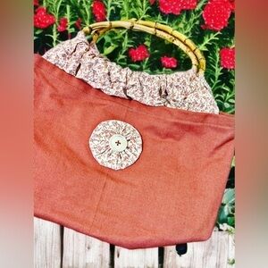 Unique pink bag with bamboo handles